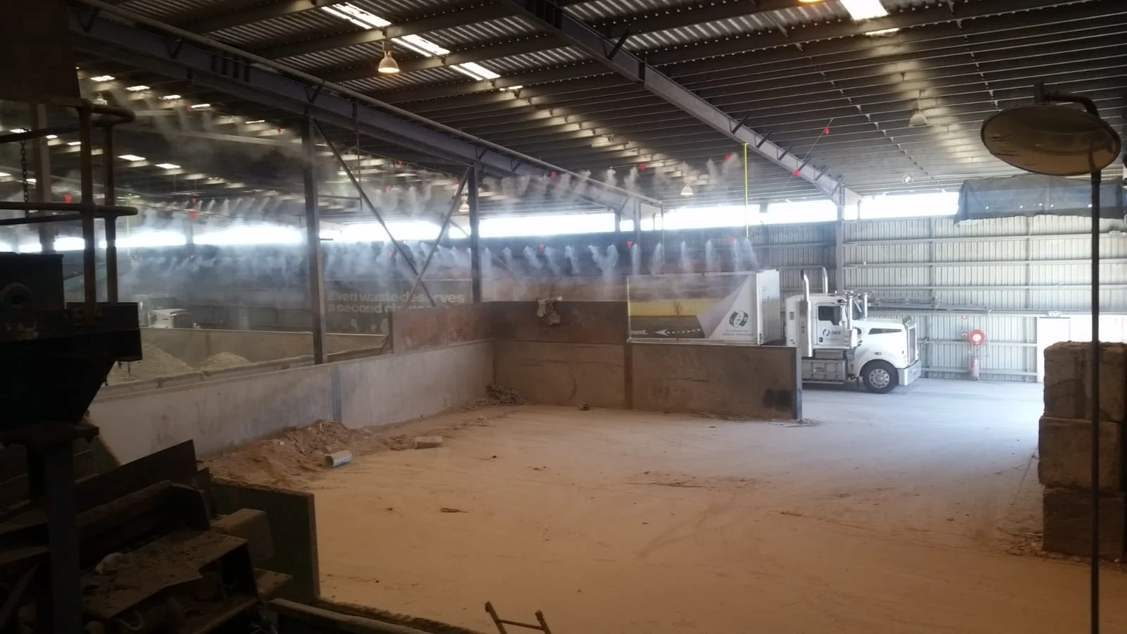 misting & spraying system in a warehouse over a truck