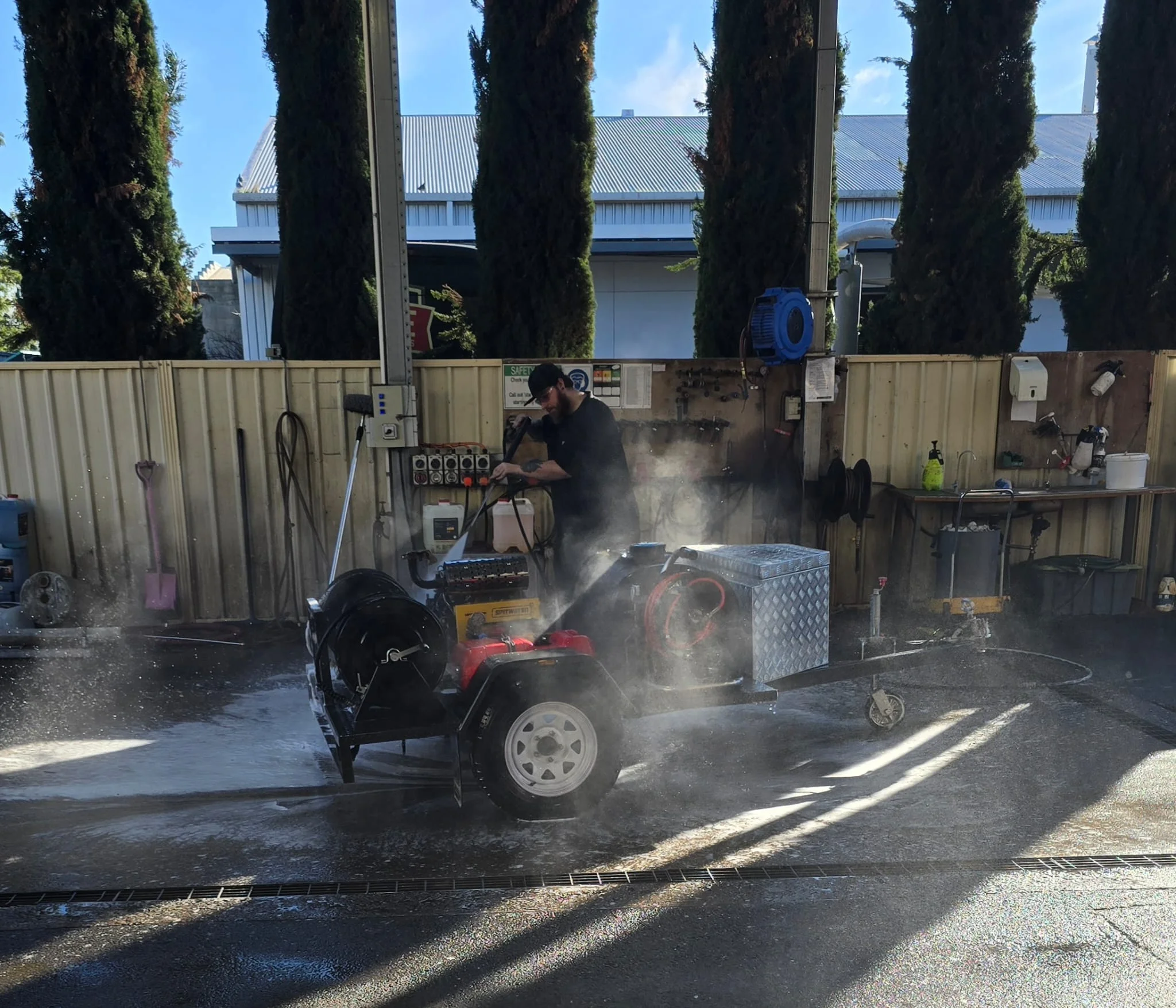 equipment service and repairs ACE washing down custom trailer build